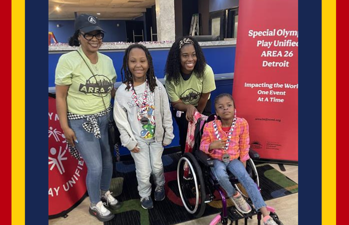  Two students receiving medals at Special Olympics Bowling Event 